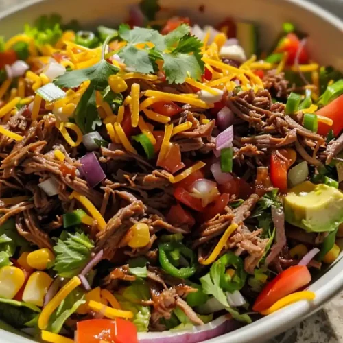 a Taco Salad with Shredded Beef in a bowl